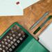 Title Image of Typewriter, Pens, and Paper.